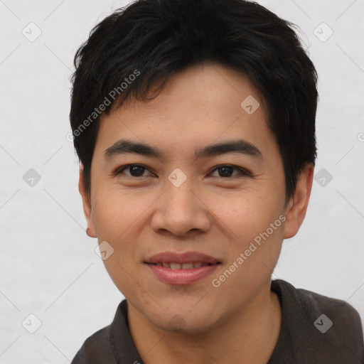 Joyful asian young-adult male with short  black hair and brown eyes