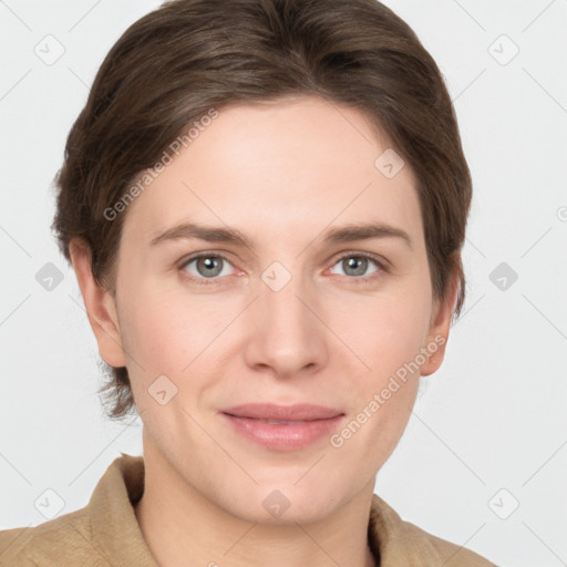 Joyful white young-adult female with short  brown hair and grey eyes