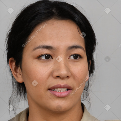 Joyful asian young-adult female with medium  black hair and brown eyes