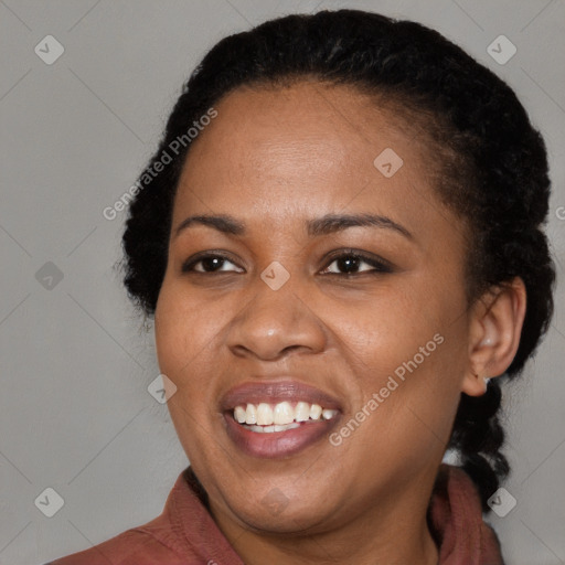 Joyful black young-adult female with medium  black hair and brown eyes