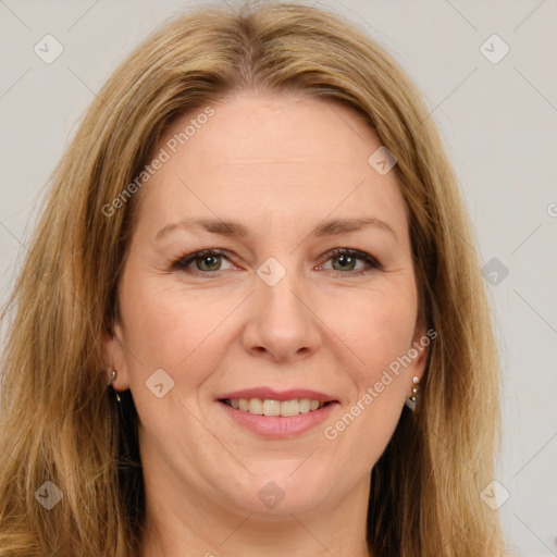 Joyful white adult female with long  brown hair and brown eyes