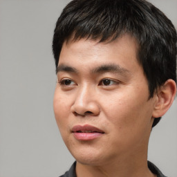 Joyful asian young-adult male with short  black hair and brown eyes