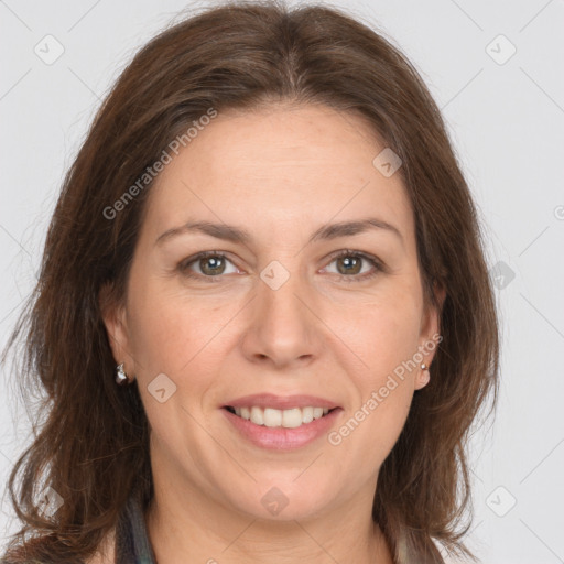 Joyful white adult female with long  brown hair and brown eyes