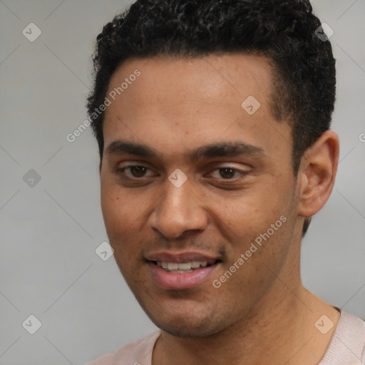 Joyful white young-adult male with short  black hair and brown eyes