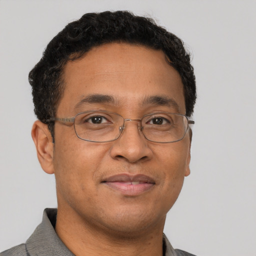 Neutral latino adult male with short  brown hair and brown eyes