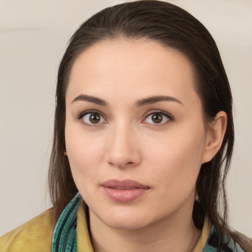 Neutral white young-adult female with long  brown hair and brown eyes