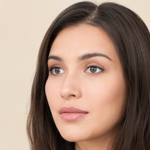 Neutral white young-adult female with long  brown hair and brown eyes