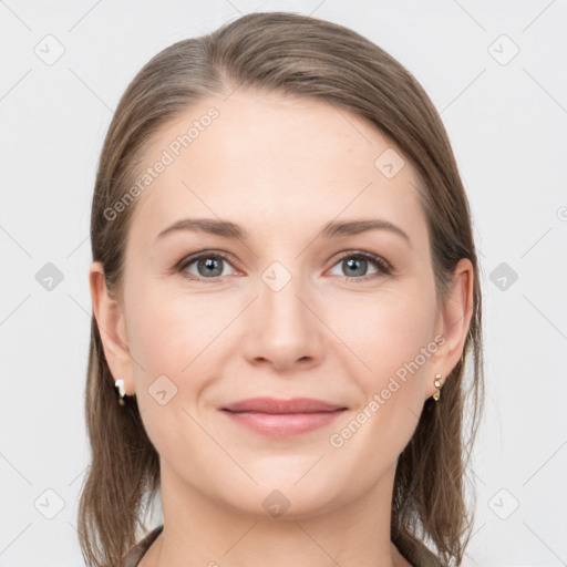 Joyful white young-adult female with medium  brown hair and grey eyes