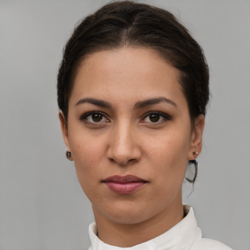 Neutral white young-adult female with short  brown hair and brown eyes
