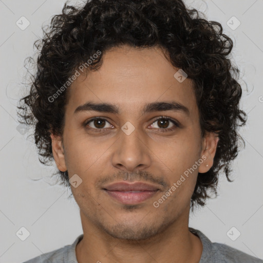 Joyful latino young-adult male with short  brown hair and brown eyes