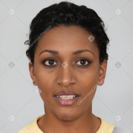 Joyful black young-adult female with short  black hair and brown eyes