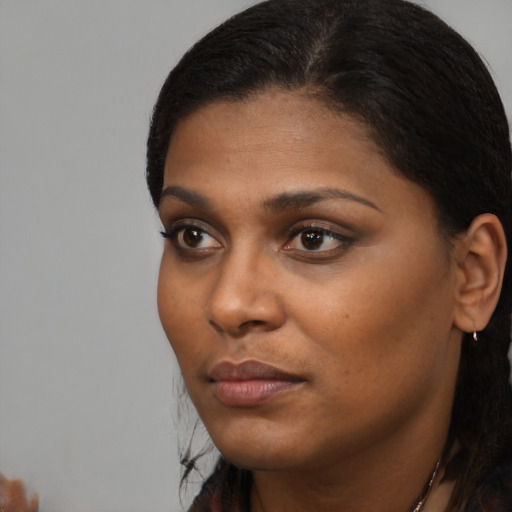 Neutral black young-adult female with short  black hair and brown eyes