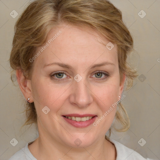 Joyful white adult female with medium  brown hair and blue eyes