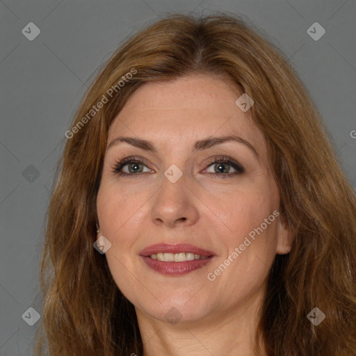 Joyful white adult female with long  brown hair and brown eyes