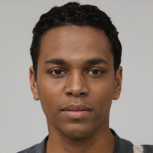 Neutral black young-adult male with short  black hair and brown eyes