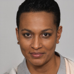 Joyful black young-adult female with short  black hair and brown eyes