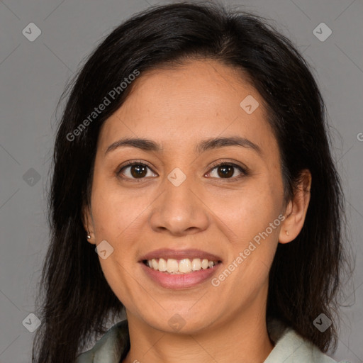 Joyful latino young-adult female with medium  brown hair and brown eyes