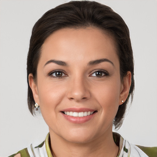 Joyful white young-adult female with medium  brown hair and brown eyes