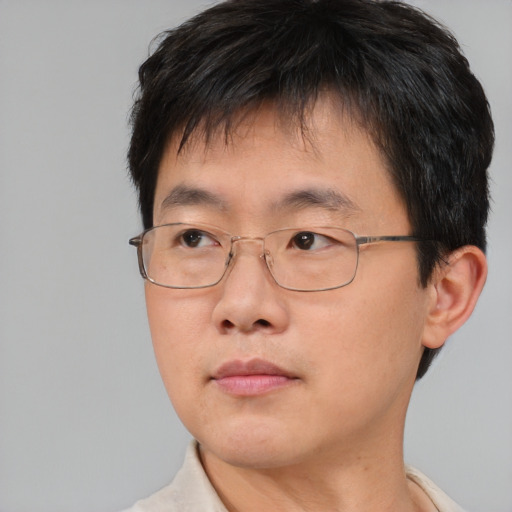 Neutral asian adult male with short  brown hair and brown eyes