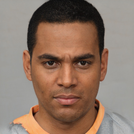 Neutral latino young-adult male with short  brown hair and brown eyes