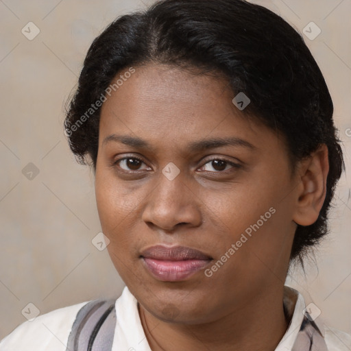 Joyful black young-adult female with short  brown hair and brown eyes