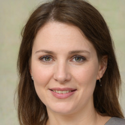 Joyful white young-adult female with medium  brown hair and green eyes