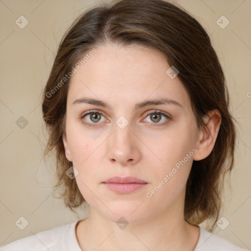 Neutral white young-adult female with medium  brown hair and green eyes