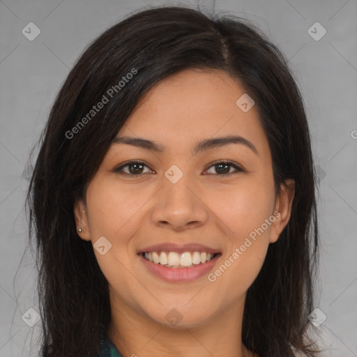 Joyful latino young-adult female with long  brown hair and brown eyes