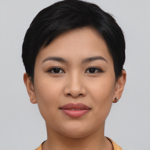 Joyful asian young-adult female with short  brown hair and brown eyes
