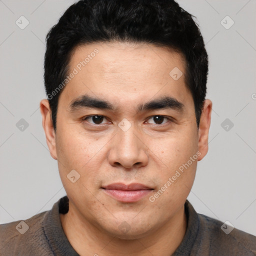 Joyful latino young-adult male with short  black hair and brown eyes