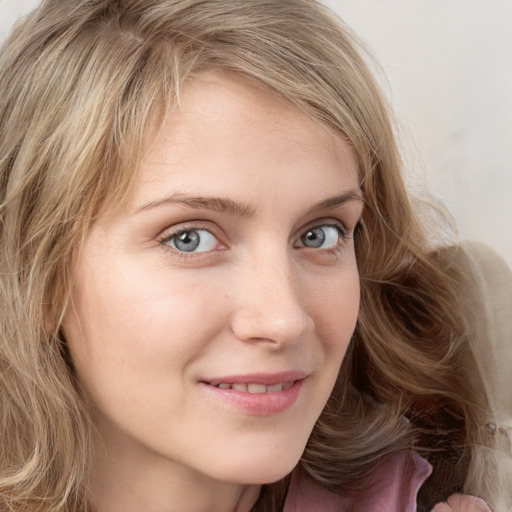 Joyful white young-adult female with long  brown hair and blue eyes