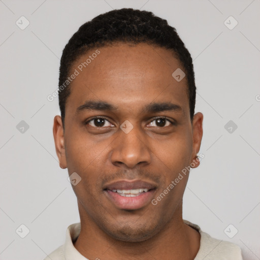 Joyful black young-adult male with short  black hair and brown eyes