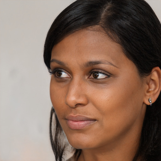 Neutral black young-adult female with long  black hair and brown eyes