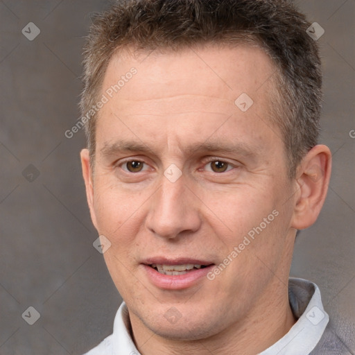 Joyful white adult male with short  brown hair and brown eyes