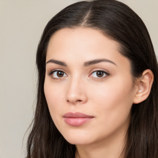 Neutral white young-adult female with long  brown hair and brown eyes