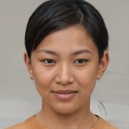 Joyful asian young-adult female with short  brown hair and brown eyes