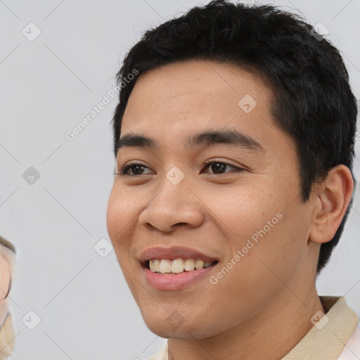 Joyful asian young-adult male with short  black hair and brown eyes