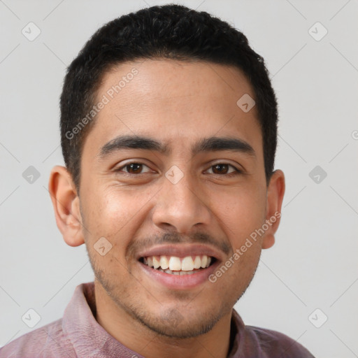 Joyful latino young-adult male with short  brown hair and brown eyes