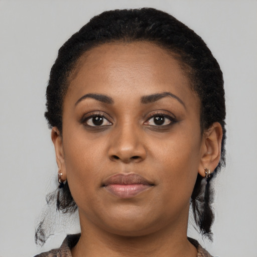 Neutral black young-adult female with medium  black hair and brown eyes