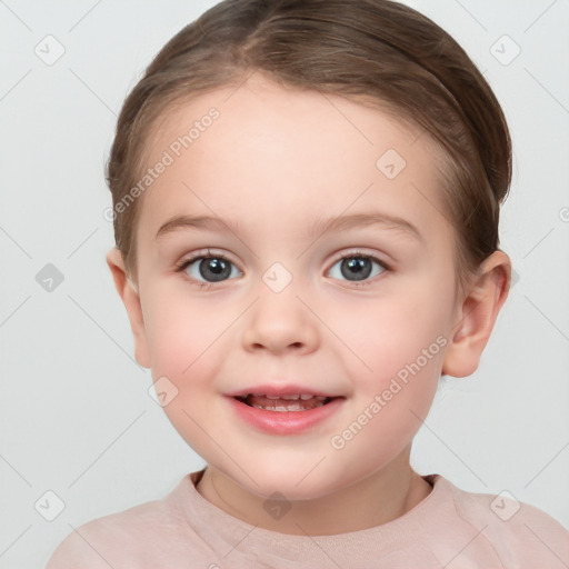 Joyful white child female with short  brown hair and brown eyes