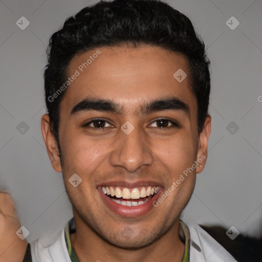 Joyful latino young-adult male with short  black hair and brown eyes