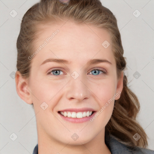 Joyful white young-adult female with long  brown hair and blue eyes