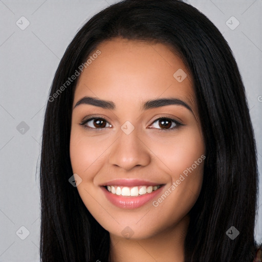 Joyful latino young-adult female with long  brown hair and brown eyes