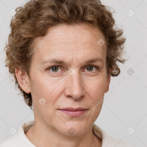 Joyful white adult female with short  brown hair and grey eyes