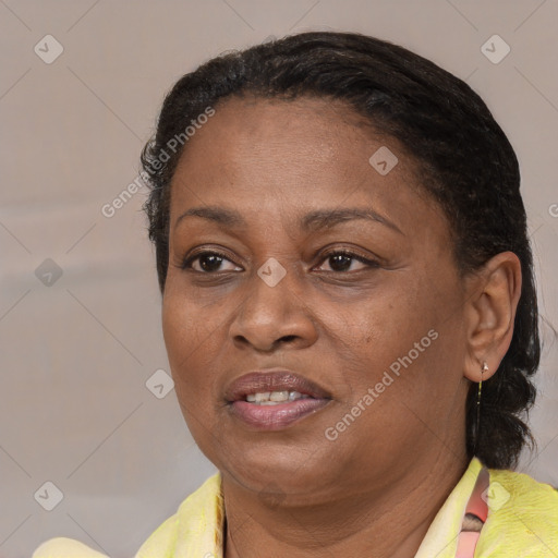 Joyful latino adult female with short  brown hair and brown eyes