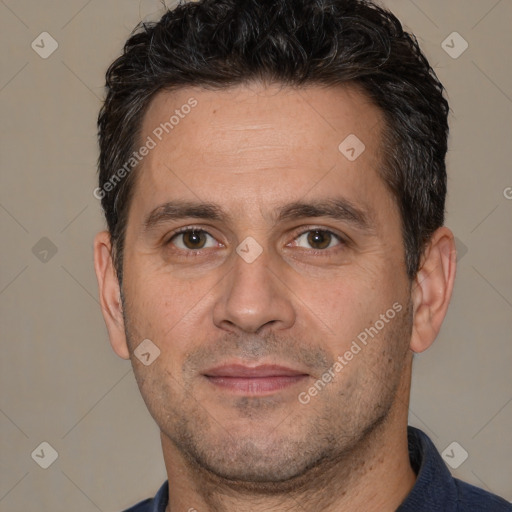 Joyful white adult male with short  brown hair and brown eyes