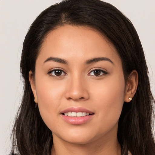 Joyful white young-adult female with long  brown hair and brown eyes