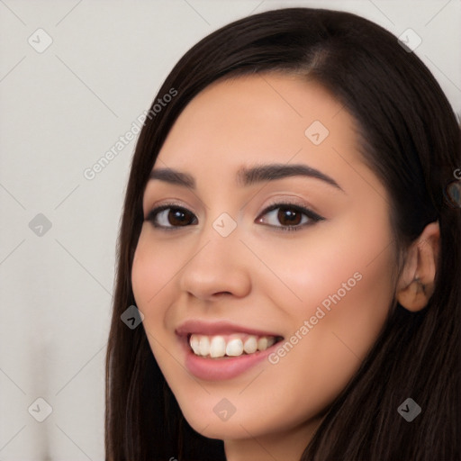 Joyful white young-adult female with long  black hair and brown eyes