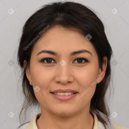 Joyful latino young-adult female with medium  brown hair and brown eyes