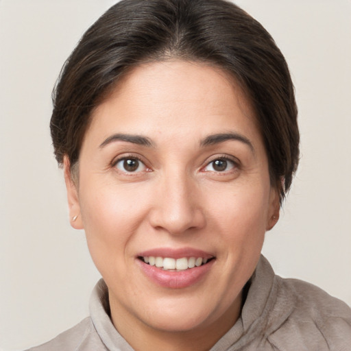 Joyful white young-adult female with short  brown hair and brown eyes